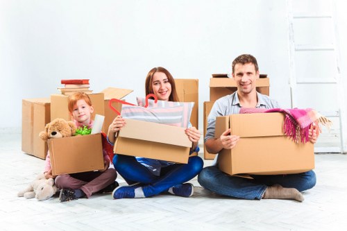 Professional movers loading belongings for a home removal service