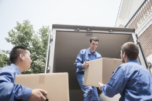 Packed boxes and furniture ready for storage near Crofton Park