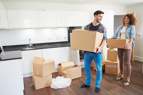 Packed office boxes and furniture ready for relocation