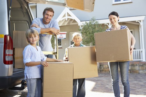 Professional movers loading household items for transport