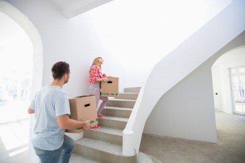Furniture and boxes being moved by a local removal van team