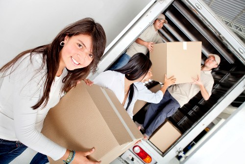 Professional movers loading household items for a Crofton Park relocation