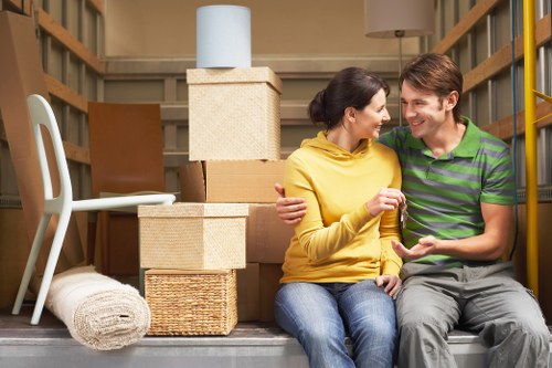 Careful loading of sofas and household furniture into a removals van